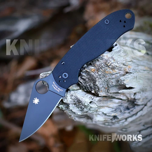 The Spyderco Para 3 C223GPBK is shown open. The black DLC-coated clip point blade with a Trademark Round Hole extends from a black textured G-10 handle with black hardware.