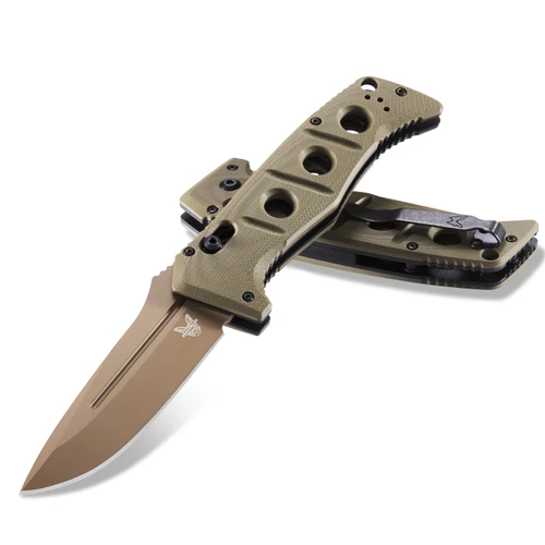 A Benchmade Auto Adamas folding knife shown with the blade deployed alongside its tan ballistic nylon MALICE Clip sheath, highlighting the MagnaCut Flat Dark Earth Cerakote drop-point blade and OD Green G10 handle with integrated spine safety switch.