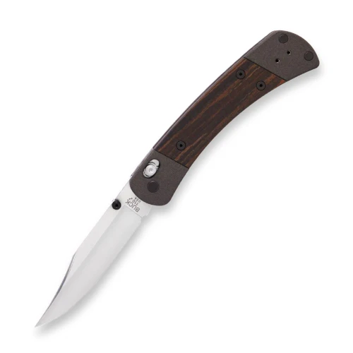 The Buck 110 Crossbar Elite (0110BRS18-B) shown with its 3.75-inch MagnaCut clip point blade in a satin finish, Cobalt Cerakoted aluminum handle with DymaLux® Macassar ebony inlays, and its black nitride deep carry reversible pocket clip. The ambidextrous crossbar lock and thumb studs are visible along the spine of this updated Buck 110 heritage folder.