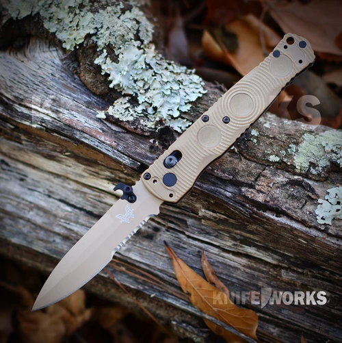 The Benchmade Mini SOCP Tactical Folder 393SSN-01 is shown open, featuring a 2.87-inch Flat Dark Earth PVD-coated CPM-D2 spear point blade extending from a Desert Tan 6061-T6 aluminum handle with an integrated retention ring, thumb disc, and AXIS Lock.