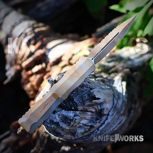 Microtech Dirac Delta 227-3DUCS double action OTF, blade deployed, Sand Dune Camo serrated dagger blade and aluminum handle