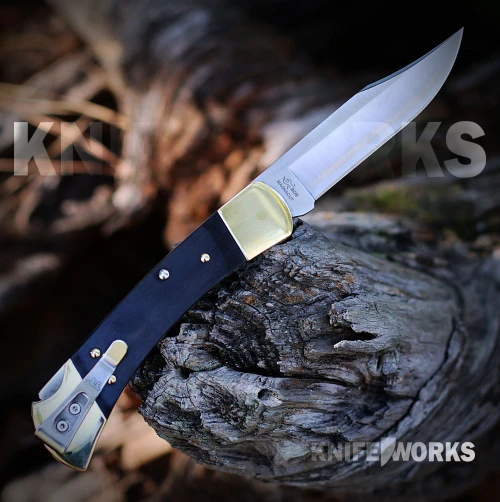 Buck 110 Slim Heritage Elite 0110BRS19 with satin CPM MagnaCut clip point plain edge blade and genuine ebony wood brass handle, open view