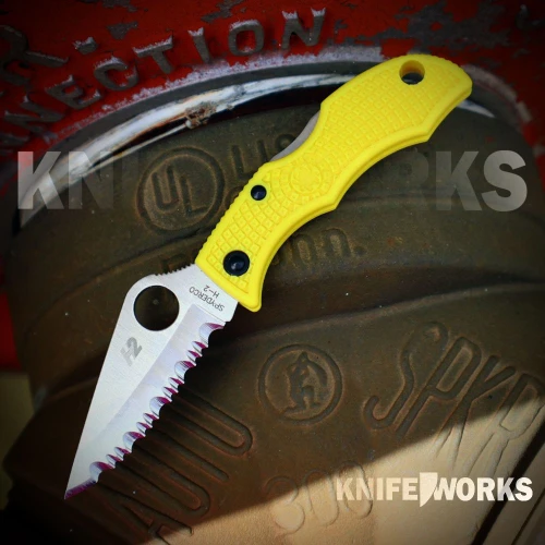 The Spyderco Ladybug 3 Salt (LYLS3) shown with its 1.9-inch H-2 hollow-ground modified clip point blade in a fully serrated SpyderEdge™, FRN handle with Bi-Directional Texture™, and the Trademark Round Hole™ opener. This clipless keychain knife is shown at actual scale alongside a set of keys.