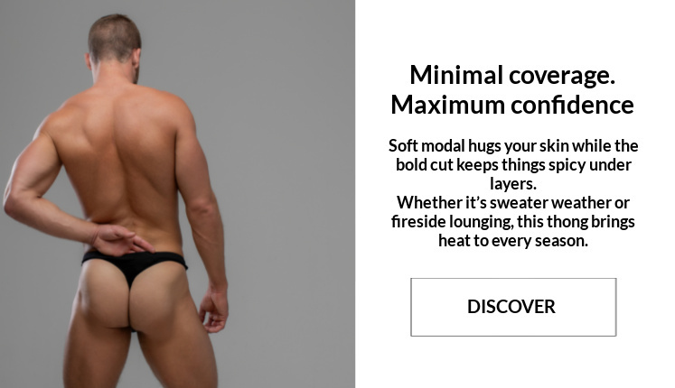 Minimal coverage. Maximum confidence.  Image:  Modal wearing a pair of Jack Adams Modal Bikini Thongs in black.