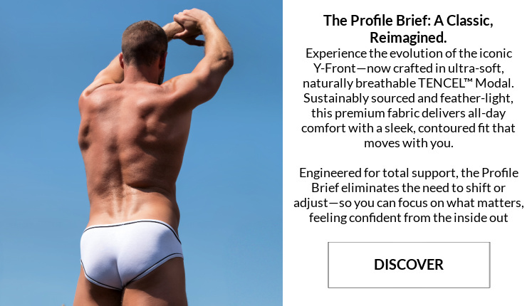 The Profile Brief. A classic, reimagined.  Image: Model is wearing a pair of Jack Adams  LUX Profile Briefs (with piping) in white with black pipiping.
