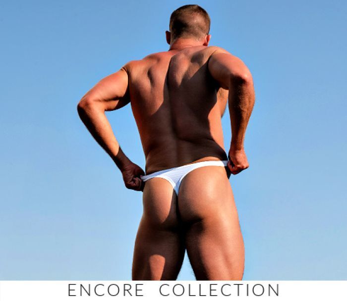 Shop the Jack Adams Encore Collection. Image: Model wearing a pair of Jack Adams Encore Low-Rise Thong in white.
