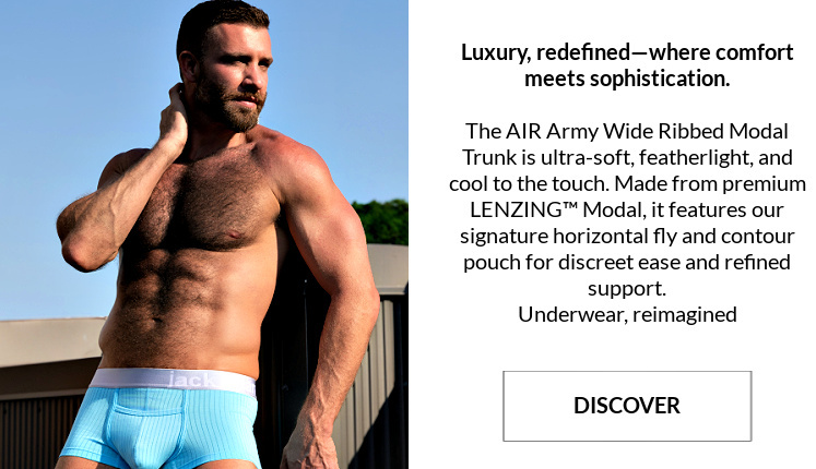 Luxury, redefined-where comfort meets sophistication. The Air Army Wide Ribbed Modal Collection.  Image:  Modal wearing a pair of Air Army Wide Ribbed Modal Trunks in aquarius.
