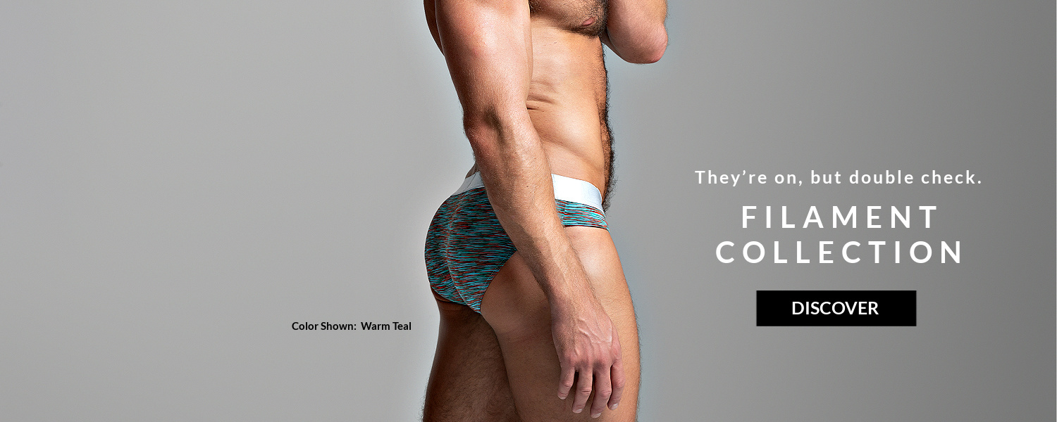 They're on, but double check. Filament Collection. Image:  Model wearing a pair of Filament Briefs in warm teal.