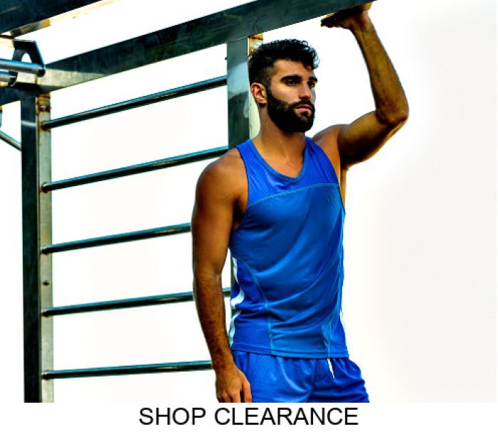 Shop Jack Adams Clearance Section.  Model wearing a pair of BCNU Sonic Sporty Tank and Shorts in royal, profile view.