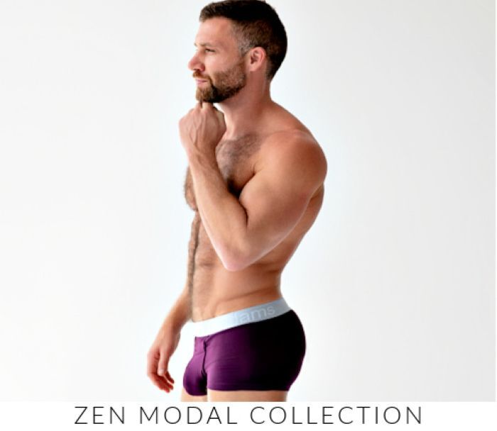 Shop Jack Adams Zen Modal Collection. Image: Model wearing a pair of Jack Adams Zen  Modal Trunks in  italian plum.
