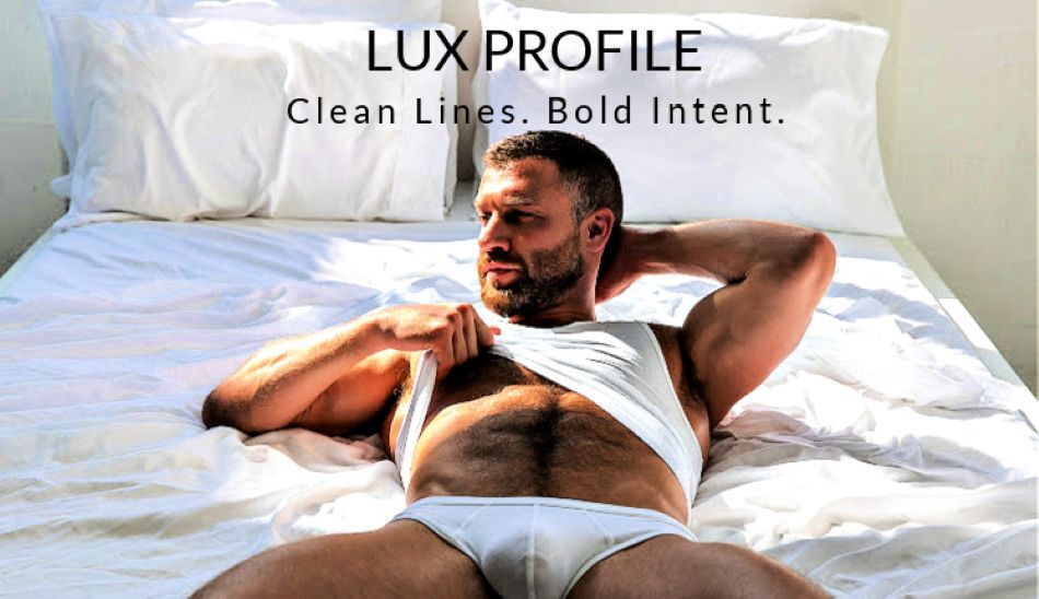 LUX Profile. Clean Lines. Bold Intent.  Image: Model wearing a pair of LUX Profile Briefs in white.