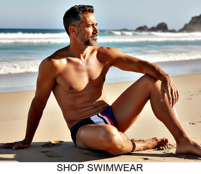 Man sitting on the beach shirtless wearing a pair of Jack Adams' Calabria Stripe Low-Rise Swimsuit