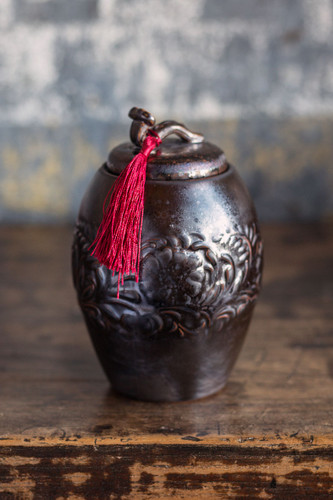 Dark Brown Ceramic Storage Canister with Red Tassel