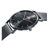 Detalle del reloj Sandoz Classic 81445-17 con esfera negra y brazalete de malla milanesa gris
