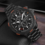 Citizen Crono Pilot Acero CB5007-51H con esfera negra en fotografía lifestyle sobre superficie oscura