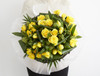 The promise of Spring, we put together this mix of Moonwalk roses, yellow spray rose, yellow tulip, green skimmia, aspirdista and chico.