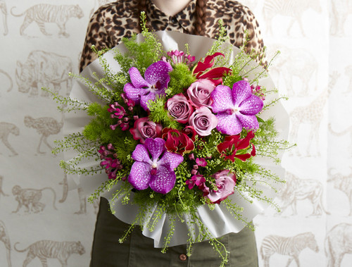 Gloriosa, Hot Magenta Vanda Orchid, Royal Velvet Bouvardia, Deep Purple Roses, Green Bell & Asparagus Ming Fern 