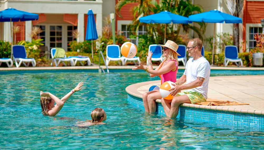 Lounge poolside or on the white sand Reduit Beach with a Bay Gardens Beach Resort day pass.