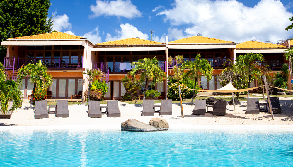 Lounge by one of the four inviting pools at True Blue Bay Boutique Resort with your day pass in Grenada.