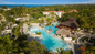 Swim-up bar and poolside lounging with a Resort for a Day pass at Tropical Beach Resort and Spa offering unlimited top-shelf drinks and Caribbean ocean views