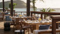 Outdoor dining area at Park Hyatt St. Kitts.  Spa Pass: provides access to the resort’s heated plunge pool, relaxation lounge, steam room, fitness center, and men’s and women’s lockers and showers.  Families enjoying St. Kitts resort day passes with access to multiple pools, beach activities, and the Sugar Mill Spa & Sanctuary at Park Hyatt St. Kitts.