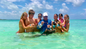 Relax on Rose Island’s private beach, paddle in turquoise waters, or snorkel around coral reefs with Resort for a Day swimming pigs excursion