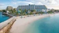 Guests enjoying cabana day passes at Margaritaville Nassau with Resort for a Day, including lunch options, premium seating, umbrellas, and lounge chairs