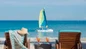 Lounge by the resort pool with included towels and sunbeds on your Grenada day pass experience.