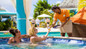 Resort day pass guests getting served cocktails poolside at Bay Gardens Beach Resort in St. Lucia. 
