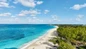 Guests enjoying the infinity edge pool with swim-up bar at RIU Palace Paradise Island Resort for a Day Nassau day pass shore excursion