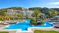 Lounge by one of the three sparkling outdoor pools at Sheraton Rhodes Resort with your day pass for cruisers.