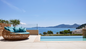 Savor cocktails and snacks from the poolside bars with your resort for a day in Corfu