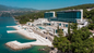 Relax on the Adriatic with your Resort for a Day pass at Hilton Rijeka Costabella, enjoying standard sunbeds and umbrellas on the beach during your cruise stop.