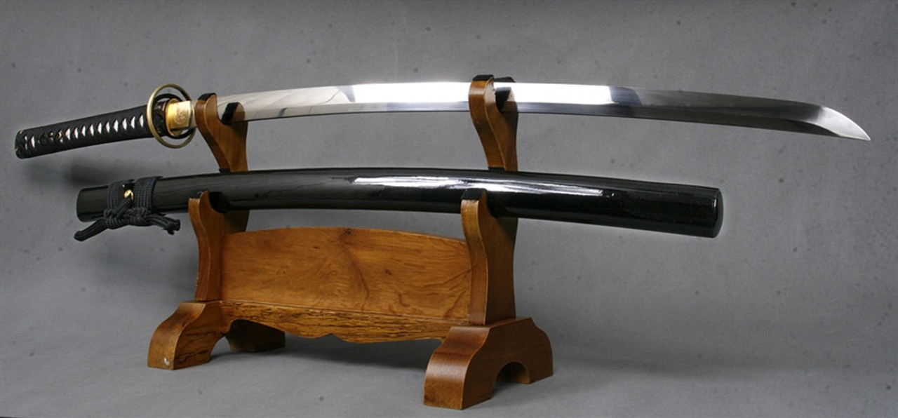 The Domoe 1075 Through Hardened Samurai Katana Sword is a