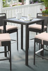 Armen Living Tropez Outdoor Patio Wicker Bar Table With Black Glass Top