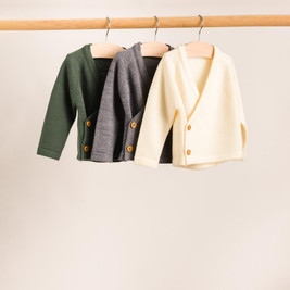 A hanging shot of The Sleep Store Merino Knitwear Kimono Cardigan in Grey Marl, Dark Green and Cream.