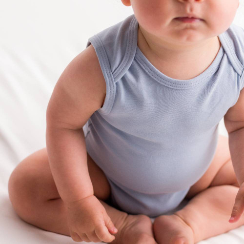 Baby wearing blue Baby Basics Organic Cotton Singletsuit