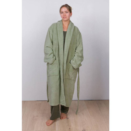A front view of a woman wearing The Sleep Store Adult Luxe Bath Robe in the colour Sage.
