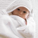 baby snuggled in a The Sleep Store cotton hooded towel.jpg
