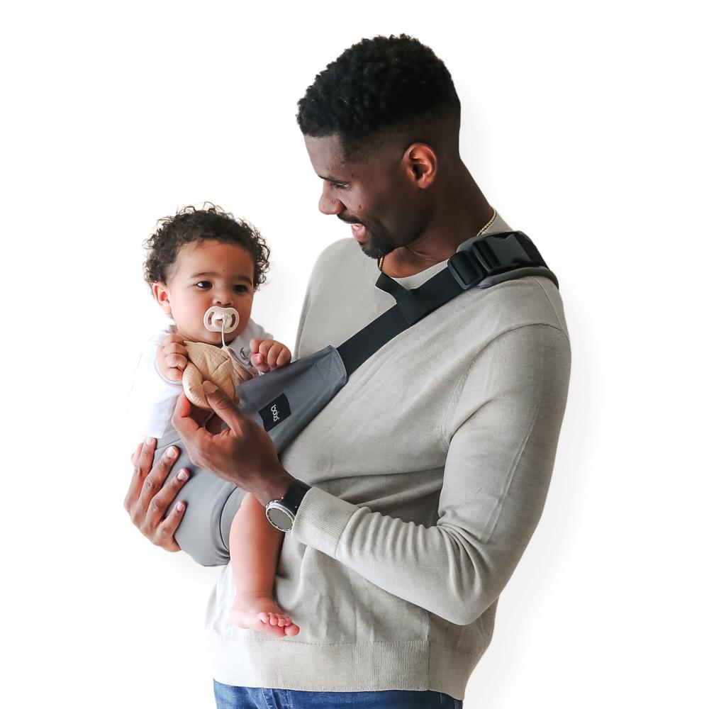 Beco Buddy Toddler Hip Carrier, Man wearing the grey carrier with a toddler.