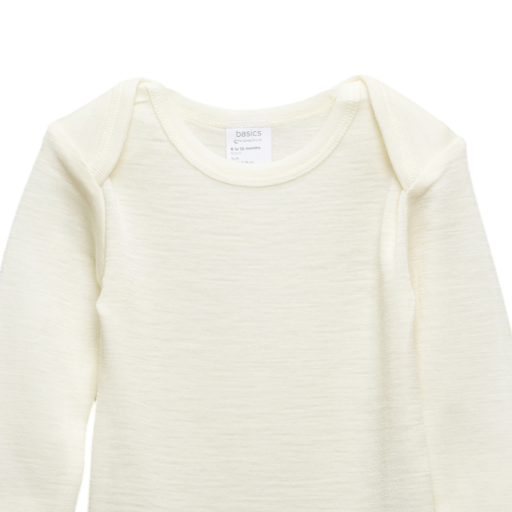 Close up of the envelope neckline of The Sleeps Store's Basics Long Sleeve Merino Bodysuit in the colour Cream.