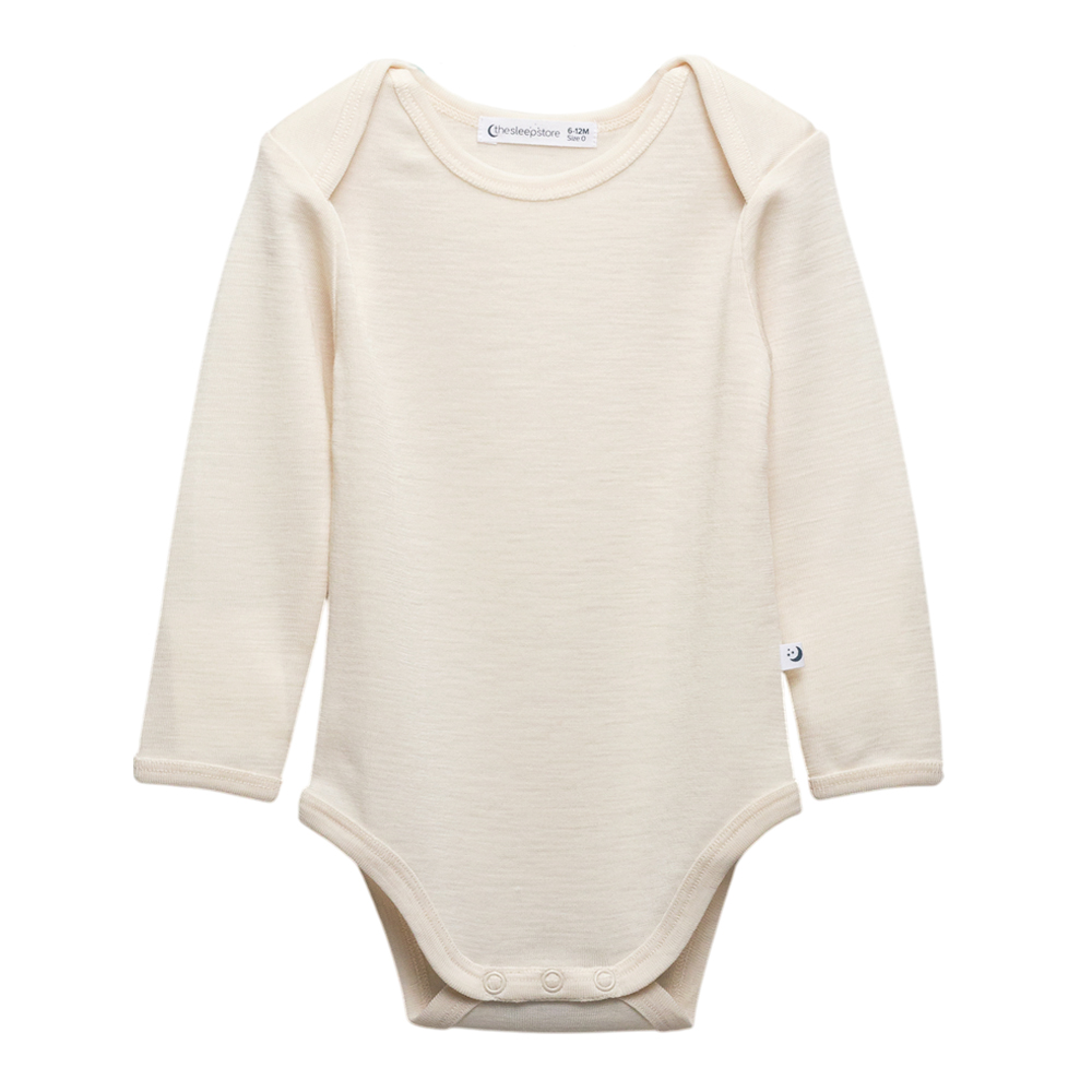 A clearcut of the Sleep Store Deluxe New Zealand Merino Wool Long Sleeve Bodysuit in the colour Ecru.