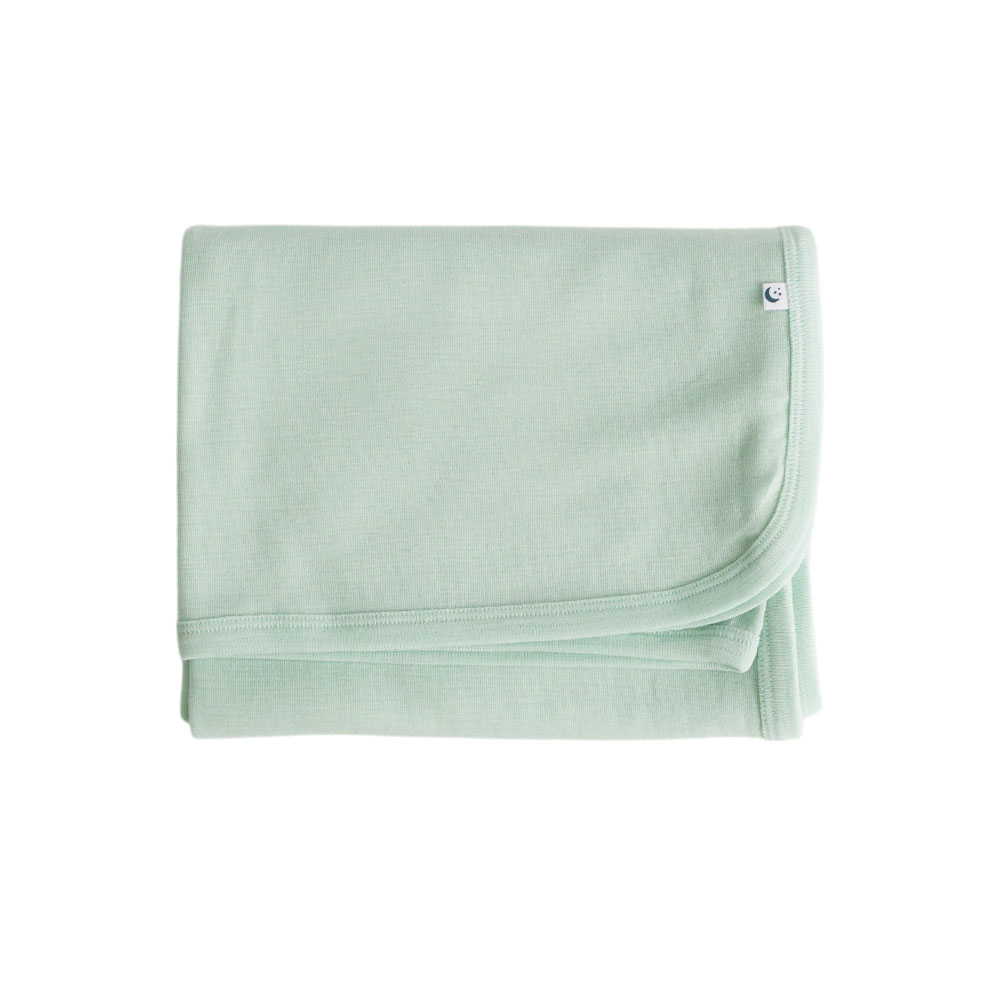 A clearcut of a folded Sleep Store Deluxe New Zealand Merino Wool Baby Swaddle Blanket in the colour Sage.