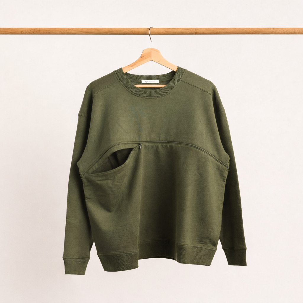 The sleep store Merino fleece crew style breastfeeding jumper hanging on a rack with one side of the breastfeeding zip open