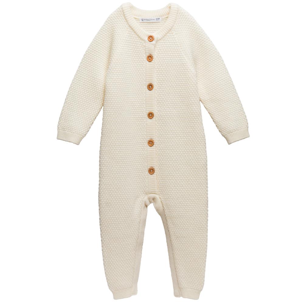 The Sleep Store Merino Knit Onesie in cream with wooden buttons