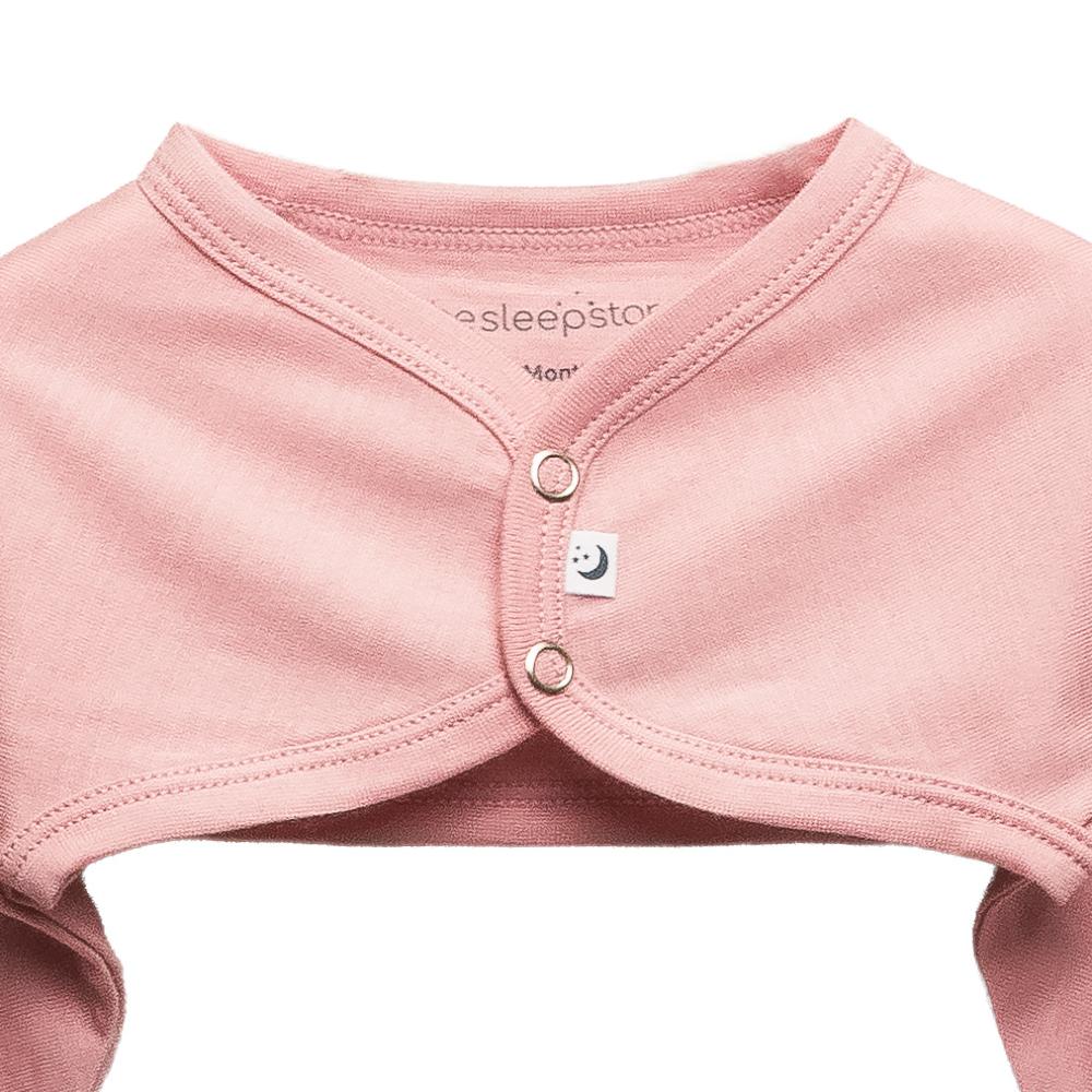 A clearcut image, front view, button detail of The Sleep Store Jersey New Zealand Merino Wool Cosy Arms in Lily Pink.