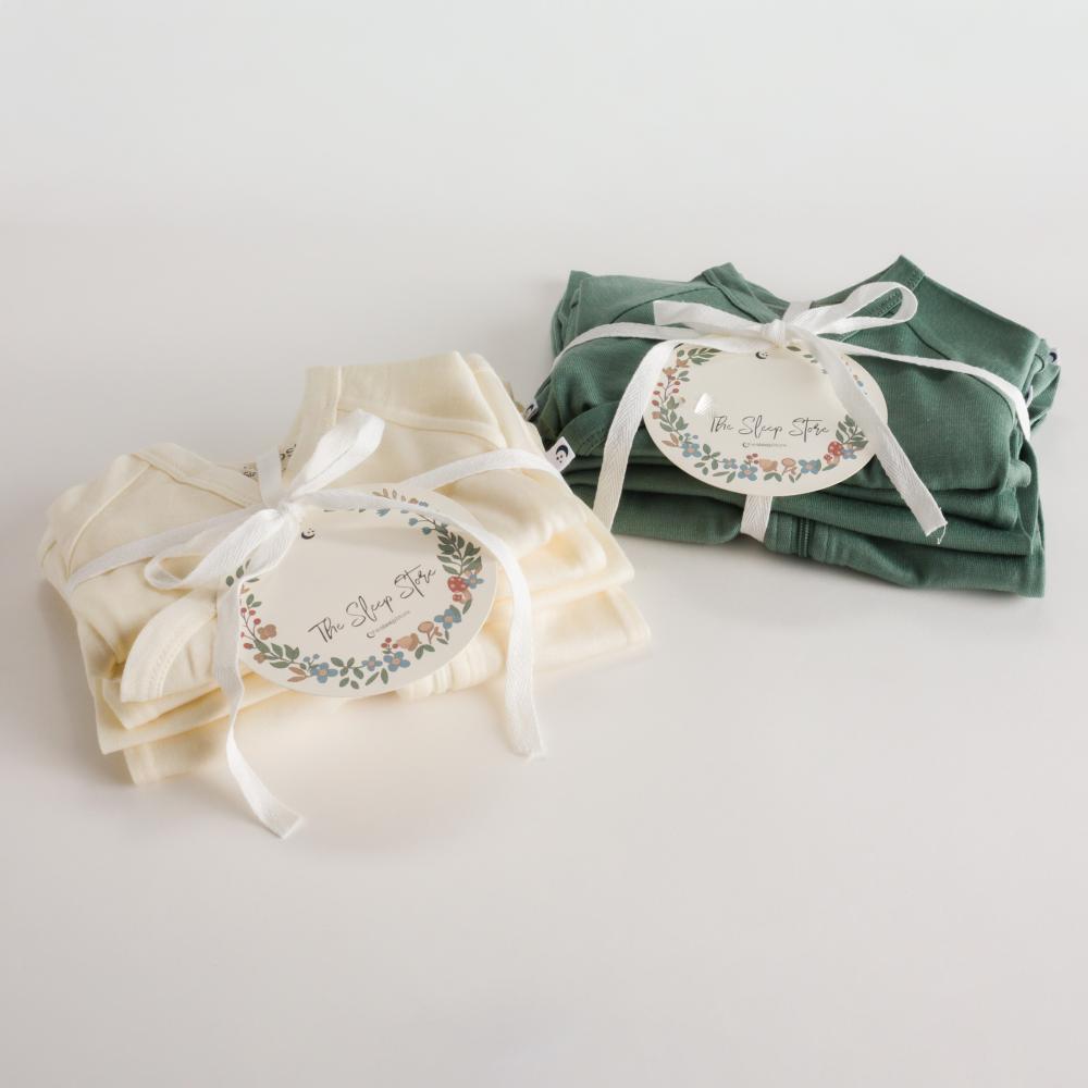 two sets of The Sleep Store newborn baby merino wool gift pack