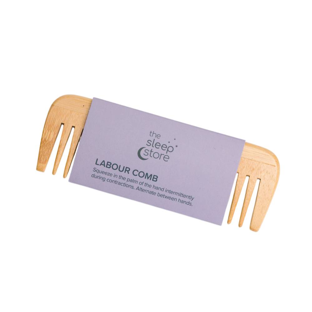 Wooden Labour Comb wrapped in  it's purple packaging strip.
