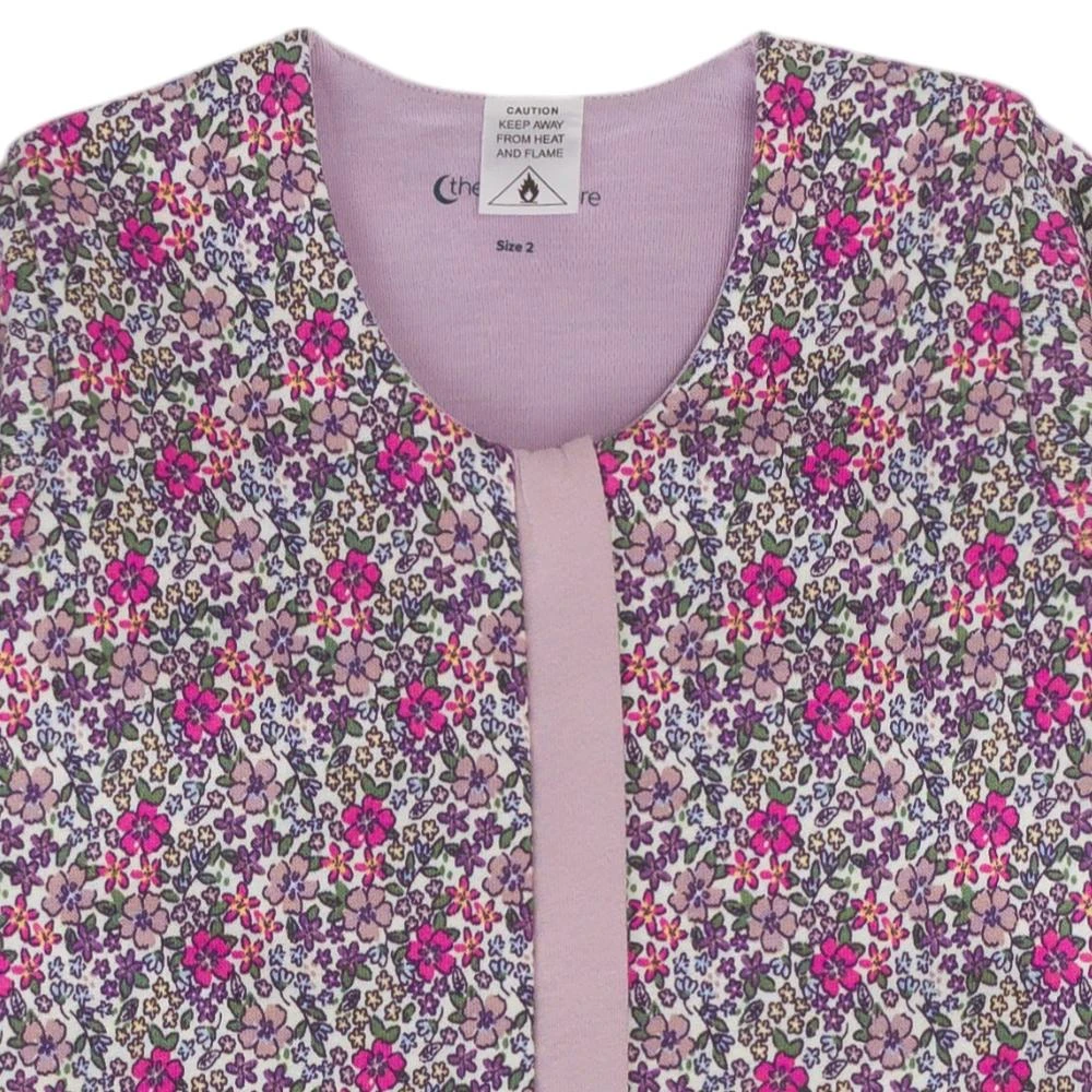 A clearcut image of The Sleep Store Premium Winter Cotton & Merino Front Zip Sleeping Suit in the colourway Blush Garden. It is a closeup of the neckline of the sleeping suit. A purple and pink floral design.