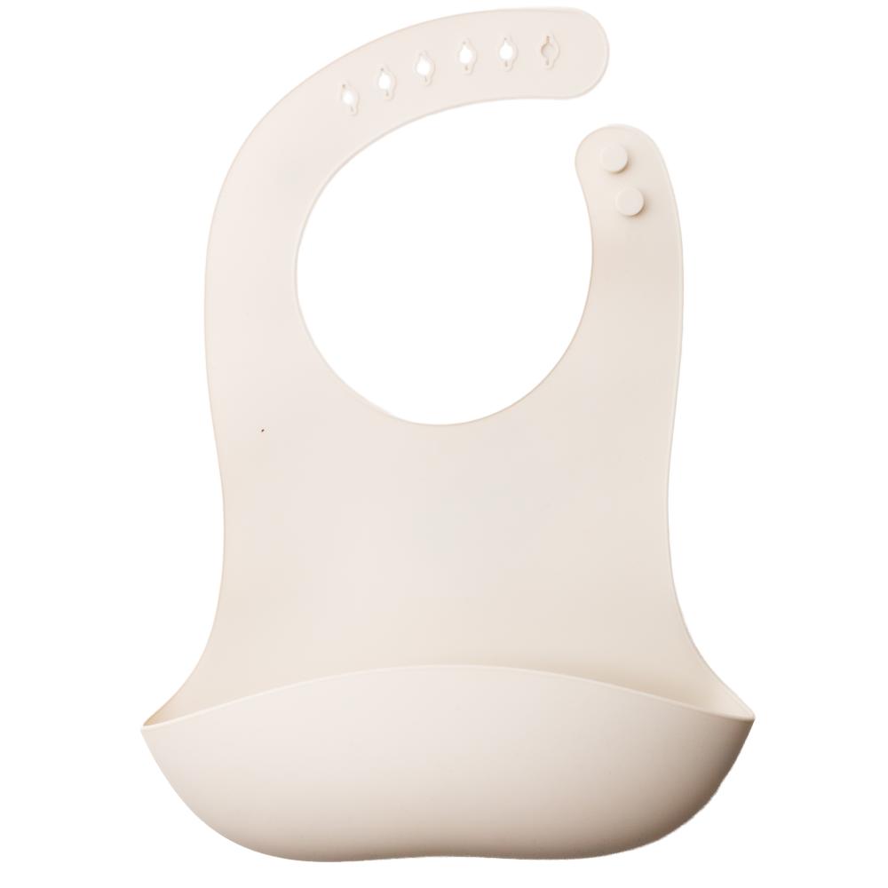 A clearcut image of the Nestling Silicone Bib in the colour Oat.